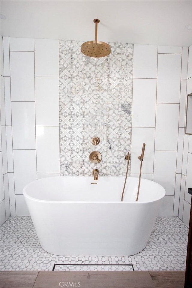 bathroom featuring tile patterned floors and tile walls