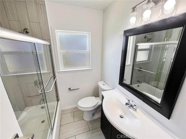 full bathroom with vanity, toilet, and enclosed tub / shower combo