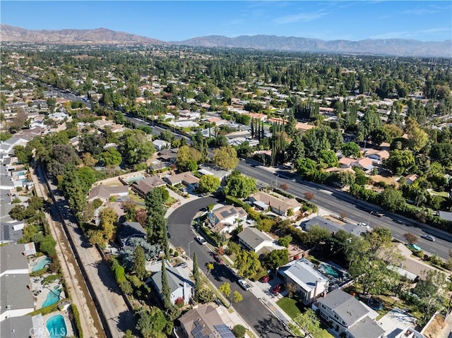 birds eye view of property featuring a mountain view