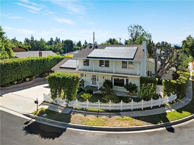 view of front of house featuring solar panels