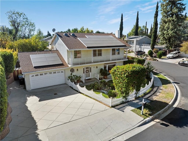 view of front property with solar panels