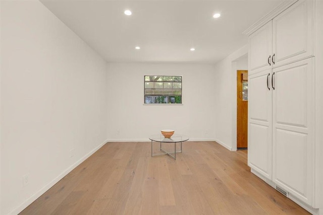 unfurnished room with light wood-type flooring