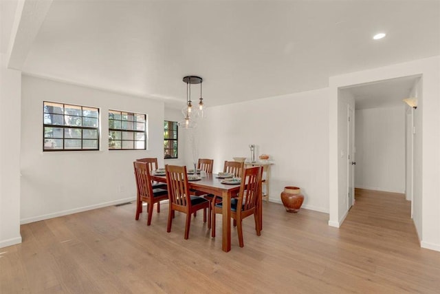 dining space featuring light hardwood / wood-style flooring