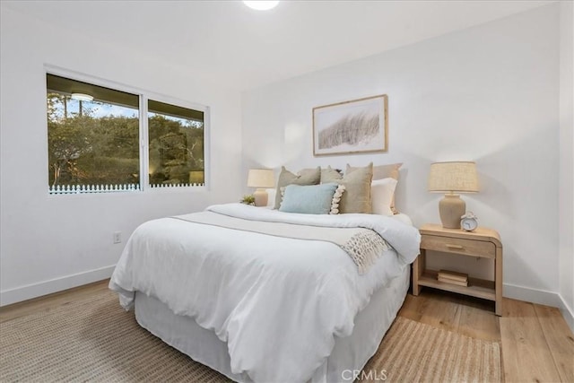 bedroom featuring hardwood / wood-style flooring