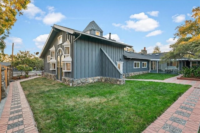 view of property exterior with a lawn