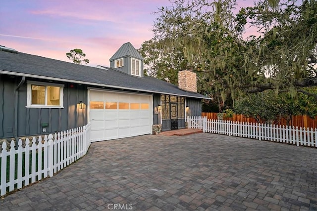 view of front of home with a garage