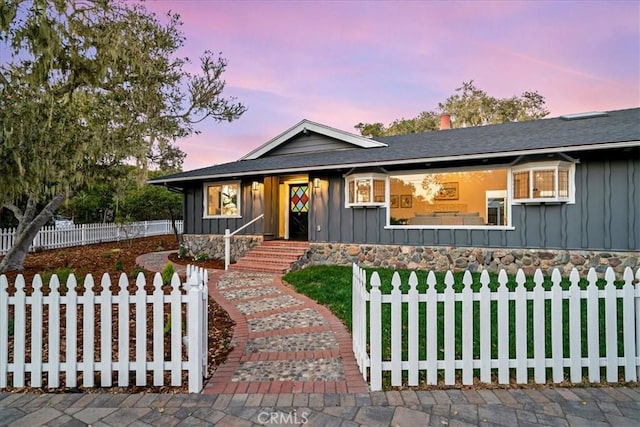 view of front of property with a yard