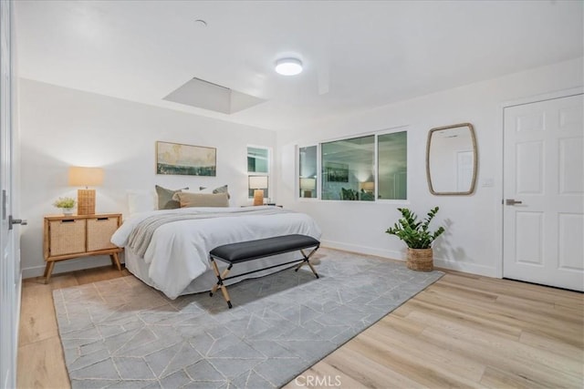 bedroom with hardwood / wood-style floors