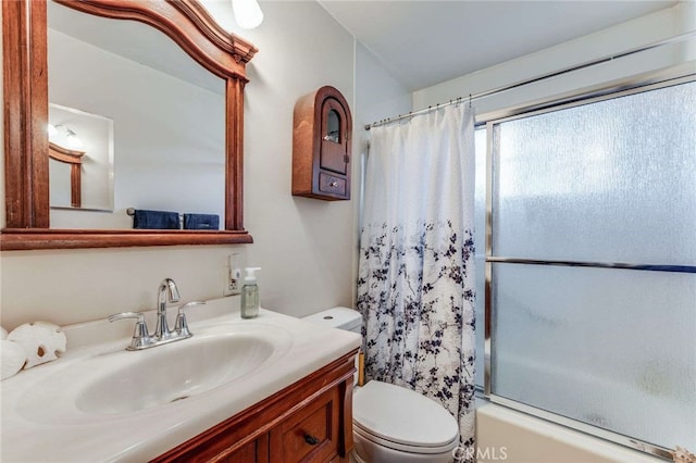 full bathroom featuring toilet, vanity, and shower / tub combo