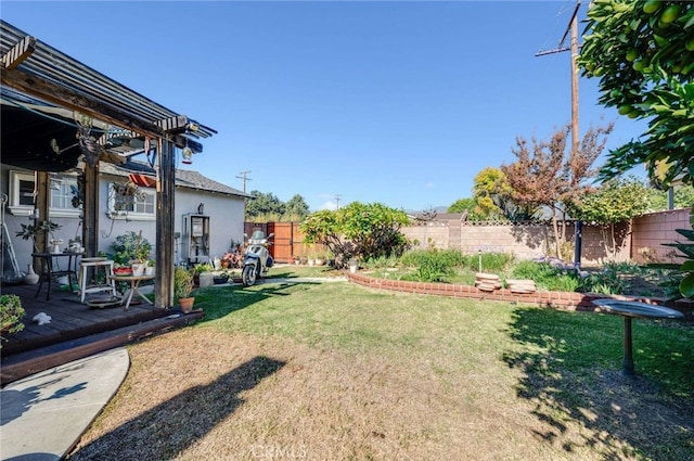 view of yard with a pergola and a deck