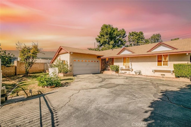 single story home with a garage