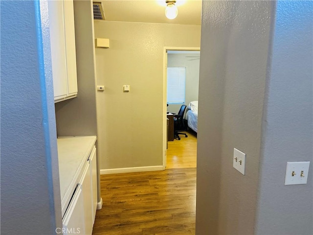 hallway featuring hardwood / wood-style floors