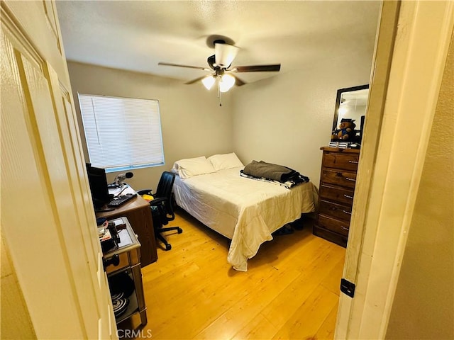 bedroom featuring ceiling fan and light hardwood / wood-style flooring