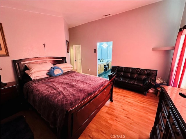 bedroom with light hardwood / wood-style floors