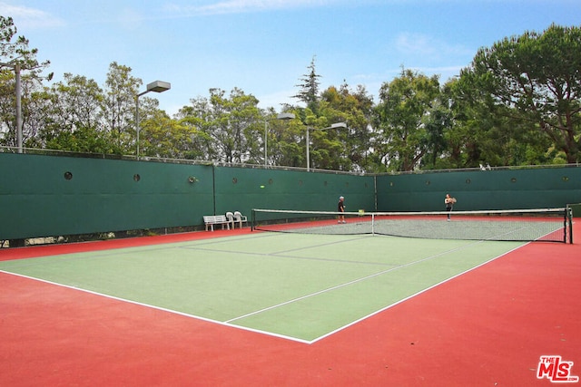 view of sport court with basketball hoop