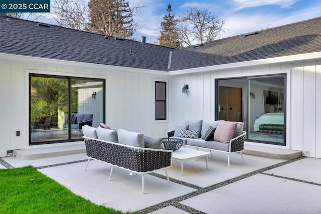 back of property featuring a patio area and an outdoor living space