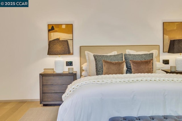 bedroom with light wood-type flooring