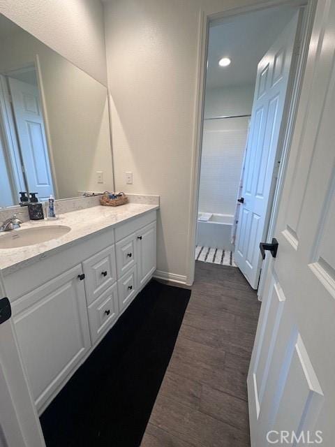 bathroom featuring hardwood / wood-style flooring and vanity