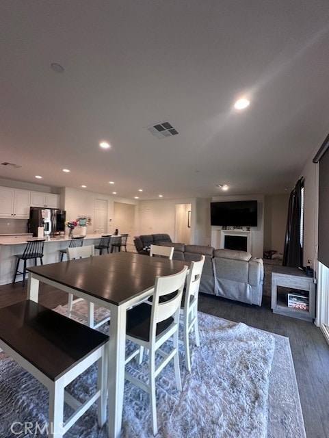 dining space featuring dark hardwood / wood-style flooring