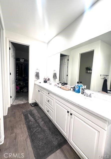 bathroom featuring vanity and wood-type flooring