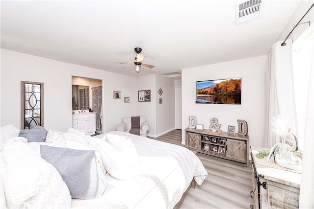 bedroom featuring connected bathroom, ceiling fan, and light hardwood / wood-style floors