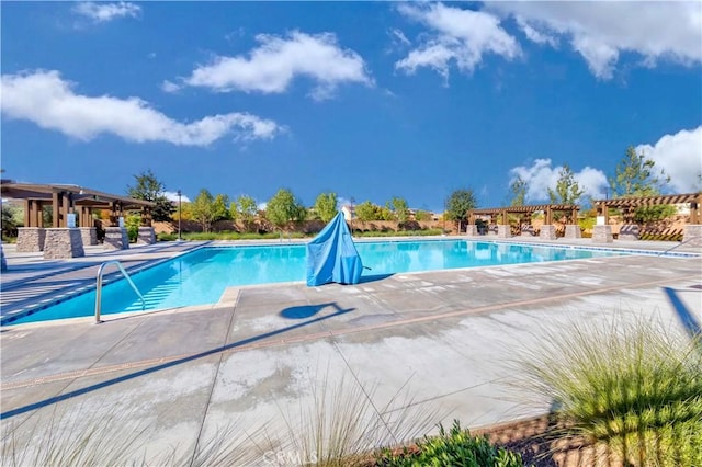 view of swimming pool featuring a patio