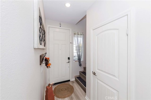 entryway with light hardwood / wood-style floors