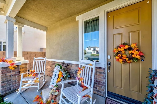 entrance to property with covered porch