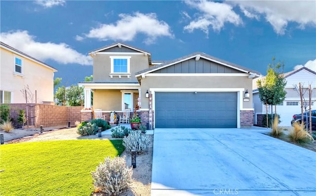 craftsman inspired home with a front lawn, covered porch, and a garage