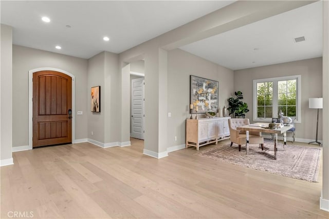 foyer with light wood-type flooring