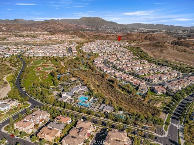 birds eye view of property featuring a mountain view