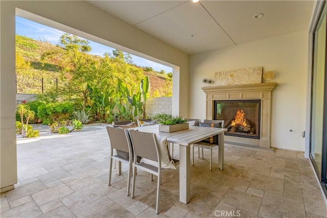 view of patio / terrace featuring exterior fireplace