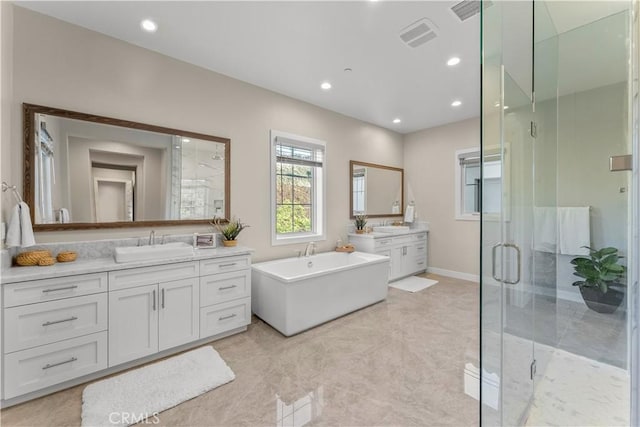 bathroom featuring separate shower and tub and vanity