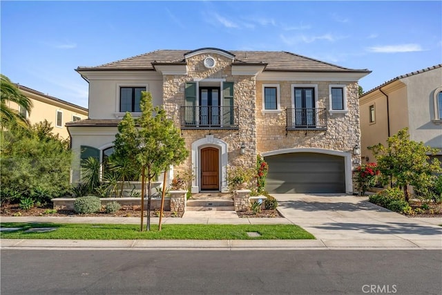 view of front of home with a balcony and a garage