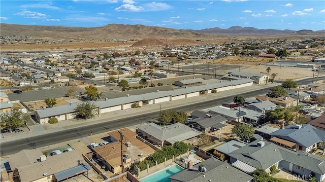 birds eye view of property with a mountain view