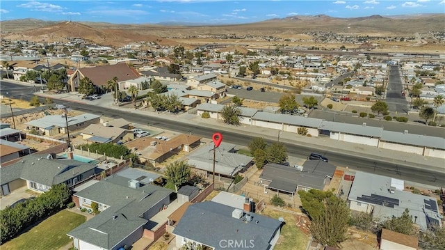 birds eye view of property with a mountain view