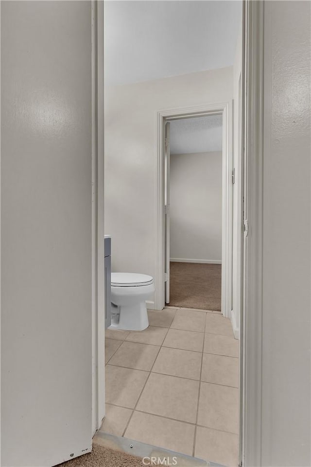 bathroom featuring tile patterned floors and toilet