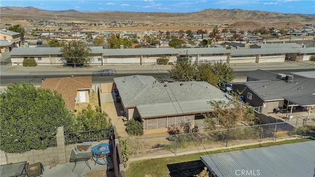 birds eye view of property featuring a mountain view