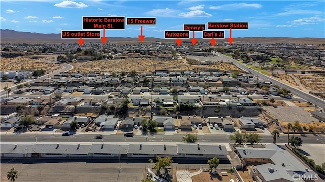 birds eye view of property with a mountain view