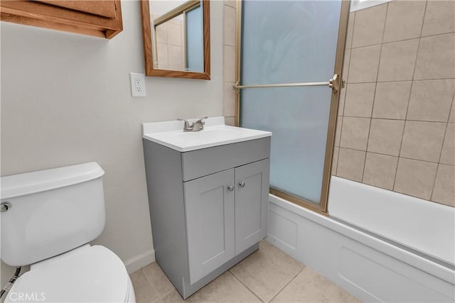 full bathroom with combined bath / shower with glass door, tile patterned floors, vanity, and toilet