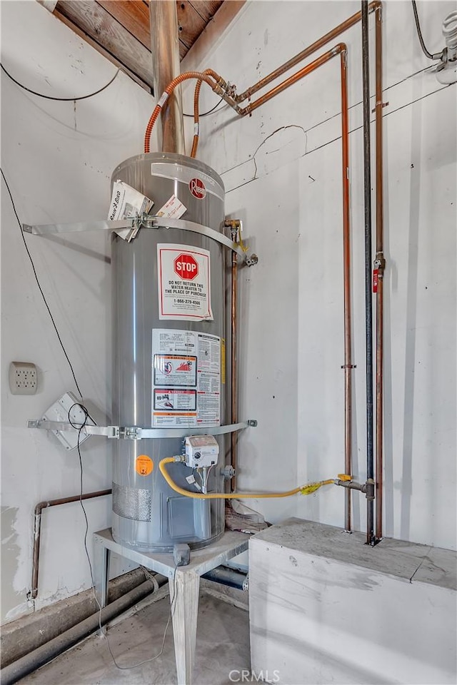 utility room with secured water heater