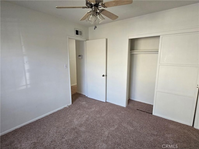 unfurnished bedroom with a closet, visible vents, carpet flooring, ceiling fan, and baseboards