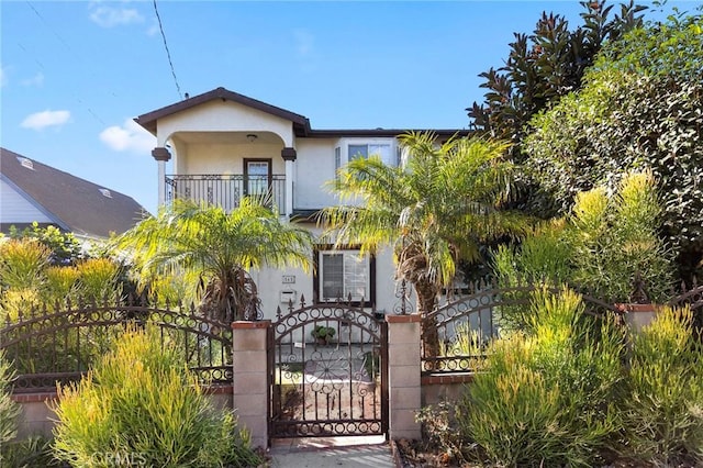 view of front of home with a balcony