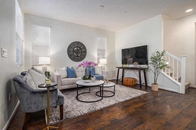 living room with dark hardwood / wood-style flooring