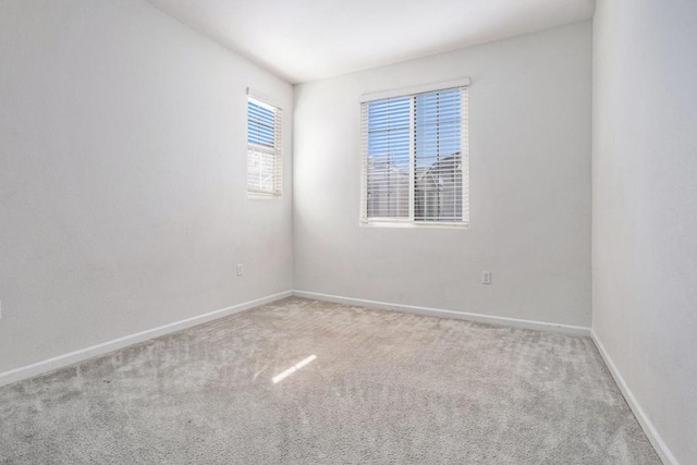 spare room featuring carpet flooring