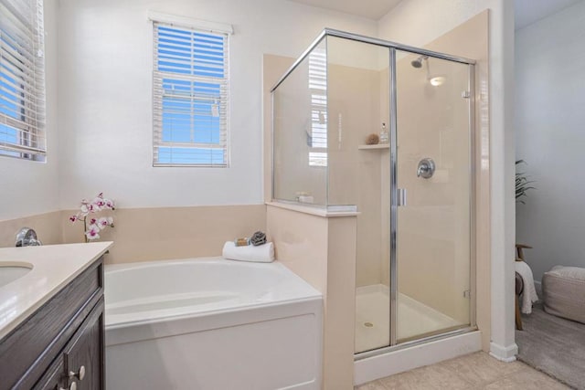 bathroom featuring tile patterned flooring, plus walk in shower, and vanity