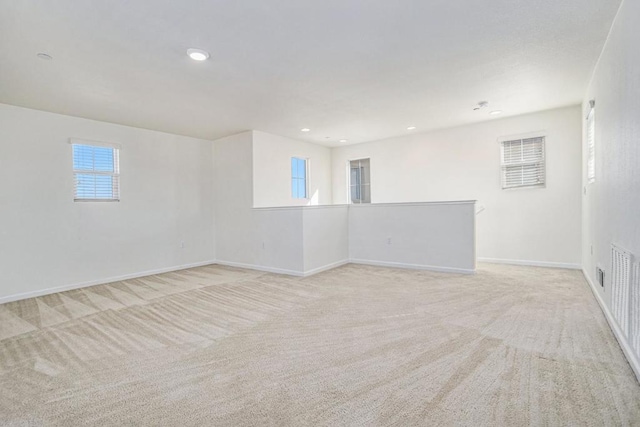 spare room with light colored carpet