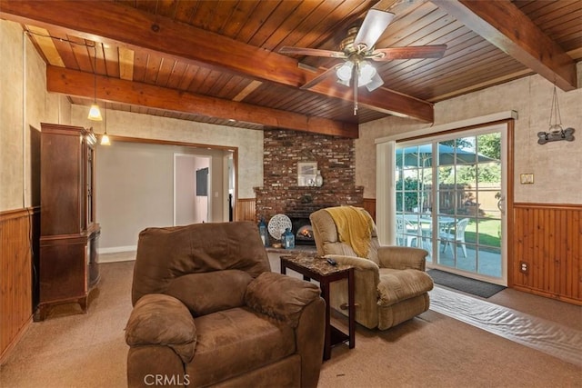 living room with wooden walls, wood ceiling, and light carpet