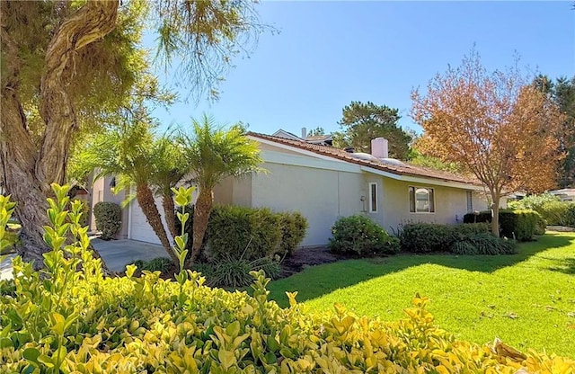 view of home's exterior with a lawn