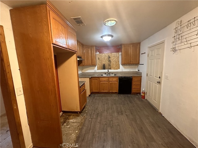 kitchen with dark wood-type flooring, dishwasher, and sink